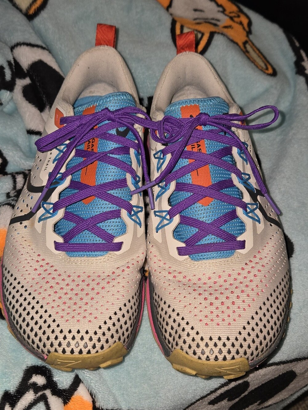 Nike Sneakers in Cream with Purple and Blue Accents